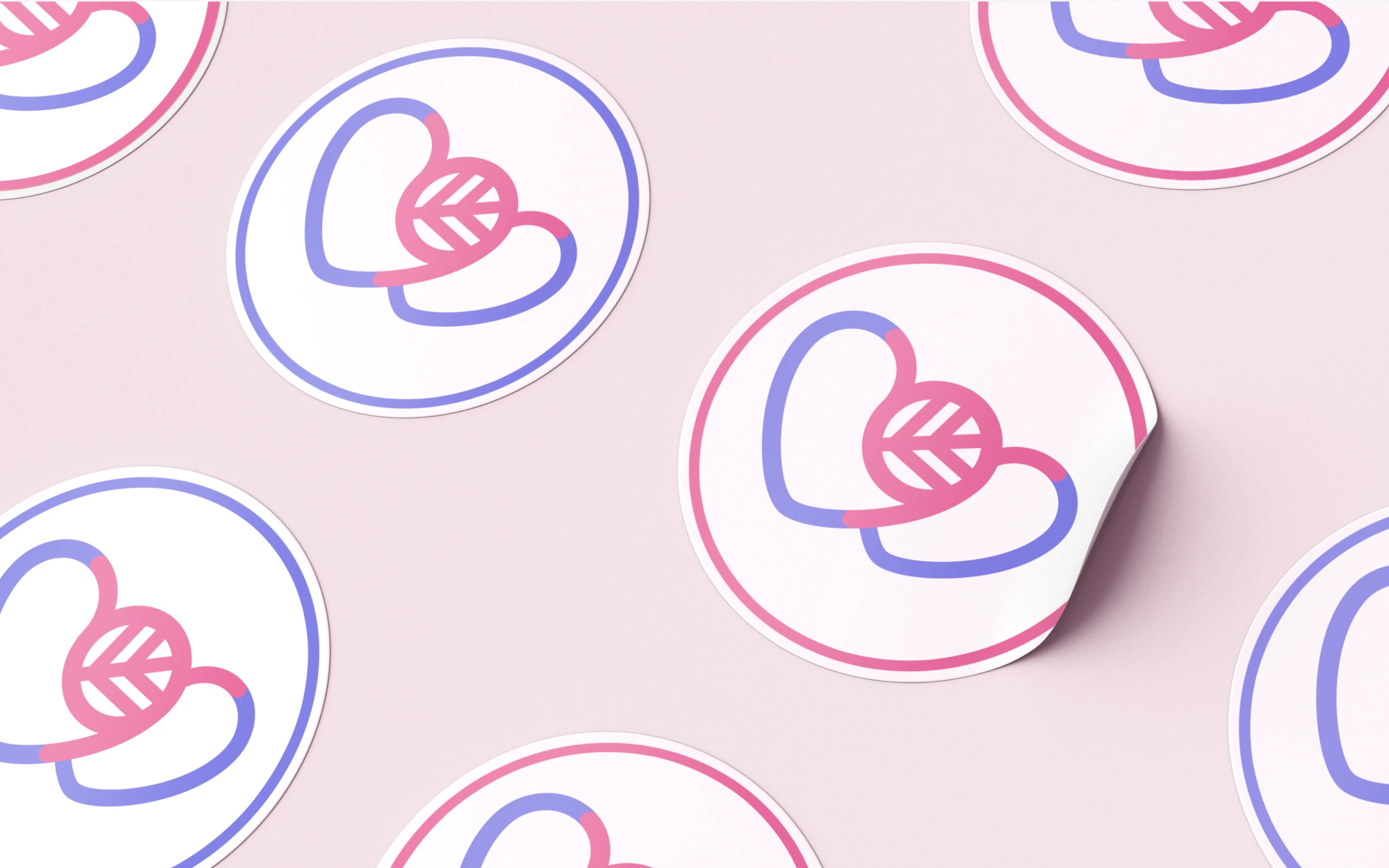 Sticker sheet of a pink and blue heart mark repeated across a soft pink surface