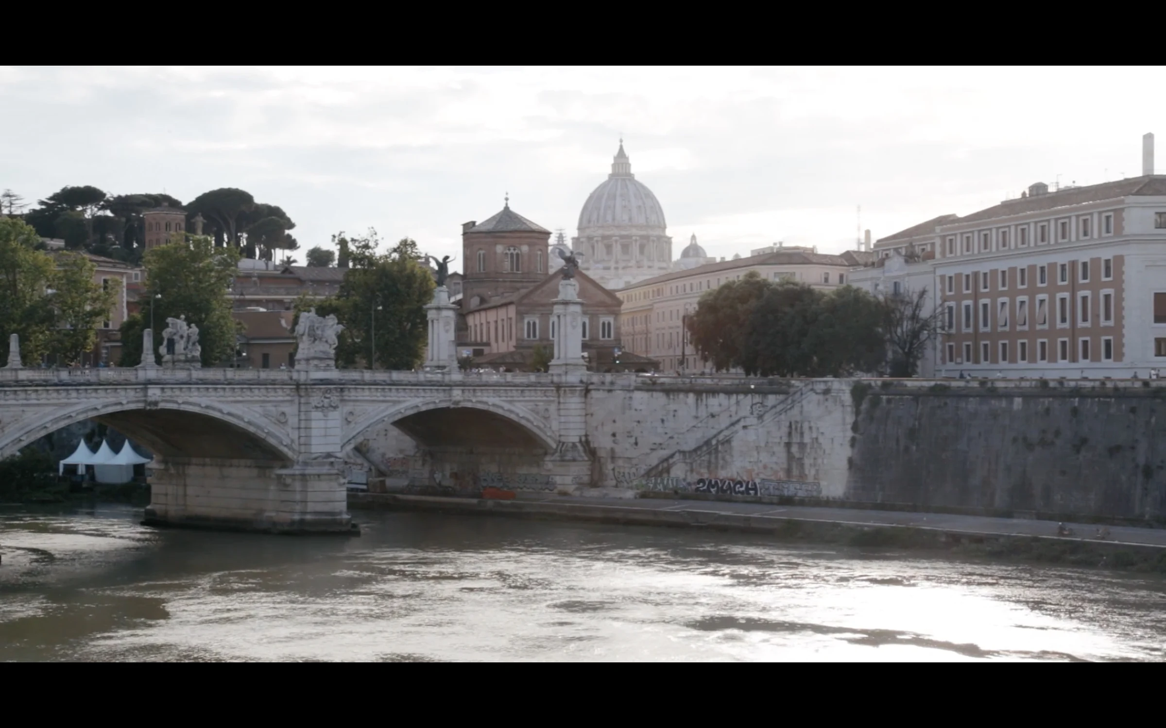 The Tiber in Rome with St. Peter's dome rising in the distance